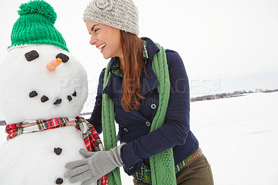 Buy stock photo Nature, winter and woman with snowman at Christmas having fun building snow figure for festive tradition outdoors. Happiness, xmas season and girl enjoying holiday, vacation and festival celebration
