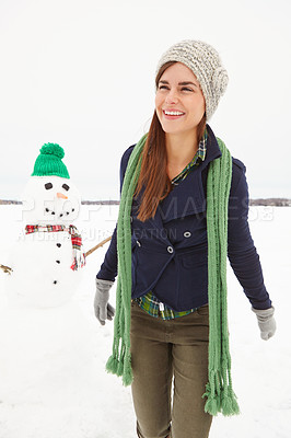 Buy stock photo Woman, snowman and happy in nature on vacation with thinking, clothes and adventure in cold. Person, ice character and memory with smile for playful creativity in countryside for holiday in Moscow