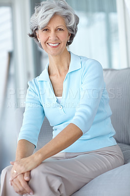 Buy stock photo Portrait, smile and senior woman in home on the sofa for relax, comfort or resting alone in living room. Happy pensioner, retirement and person on couch in casual clothes in apartment in Switzerland