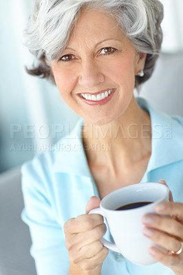Buy stock photo Senior woman, portrait and coffee on couch in home, satisfaction and confident for peace or calm. Female person, drinking tea and smile in retirement, wellness and happy in apartment for good mood
