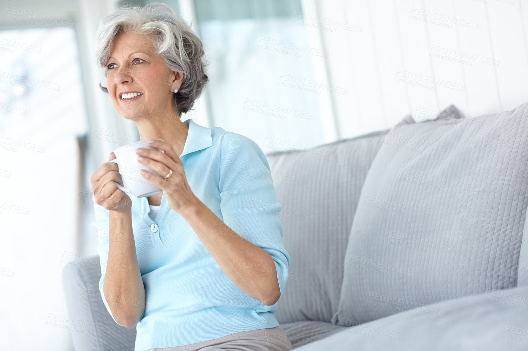 Buy stock photo Senior woman, thinking and coffee in home on weekend, inspiration and confident for peace or calm. Female person, drinking tea and smile in retirement, wellness and happy in apartment for good mood 
