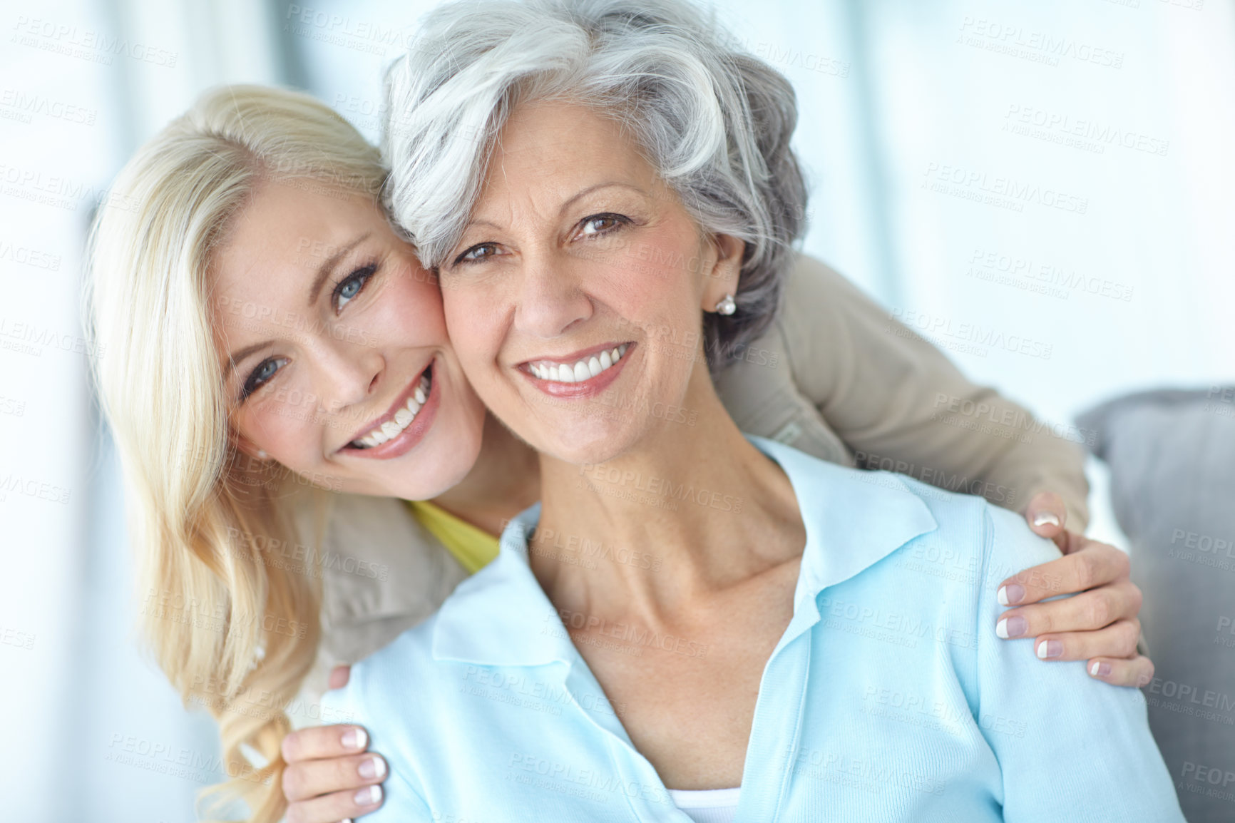 Buy stock photo Portrait, happy and mother with daughter in house for love, together and bonding in living room. Mature woman, girl and back hug with smile in home for connection, care and family quality time