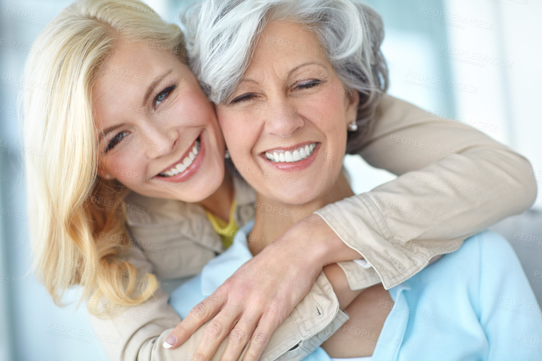 Buy stock photo Portrait, happy and mother with daughter in house for love, together and bonding in living room. Senior woman, girl and hug with smile in home for care, connection and family time while in retirement