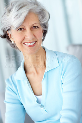 Buy stock photo Portrait of senior woman smiling with healthy white teeth. Beautiful old female standing alone inside a room. Happy attractive mature lady with short hair. Pretty older person with good dental care