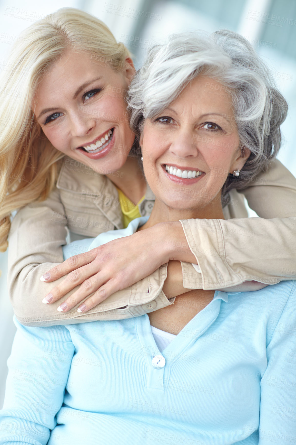 Buy stock photo Portrait, happy and mother with daughter in house for love, bonding and together in living room. Senior woman, girl and hug with smile in home for connection, care and family time while on retirement