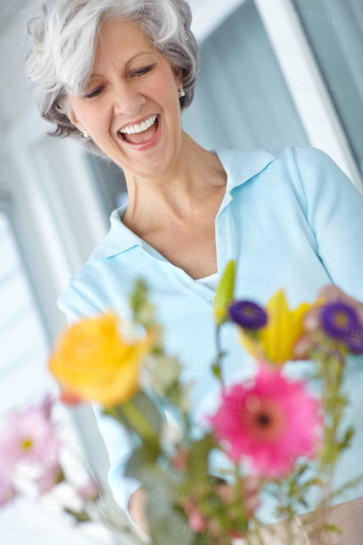 Buy stock photo Elderly woman, vase and happy with flowers in home, thinking and natural floral decoration in morning. Senior person, smile and style with bouquet, hobby and glass container in house for retirement