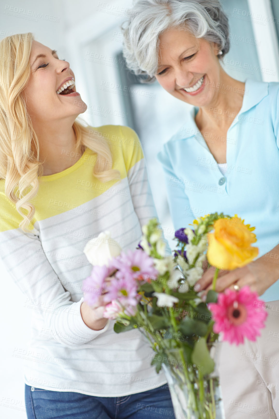 Buy stock photo Laughing, mom and happy woman with flowers in house together with love, joke or pride for gardening. Mothers day, senior or funny daughter bonding in home with family, parent or gift present in USA