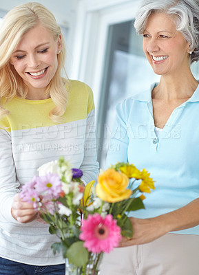 Buy stock photo Smile, parent and happy woman with flowers in home together with love, pride or wellness for gardening. Mothers day, senior or daughter bonding in family house with mom, plants or gift present in USA