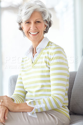 Buy stock photo Portrait, happiness and elderly woman in retirement or home to relax in living room with savings from pension. Senior, person and smile on couch in house on calm holiday or morning in vacation