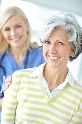 Buy stock photo Nurse, woman and mature portrait for support, healthcare and hand on shoulder with medical worker in hospital. Appointment, checkup and caregiver for trust with professional, patient and happy