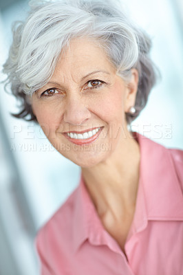 Buy stock photo Portrait of happy senior caucasian woman with grey hair at home. Face and neck of cheerful retired lady showing benefits of collagen supplements to aid anti ageing and youthful skin and good dental