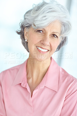Buy stock photo Portrait of senior woman smiling with healthy white teeth. Beautiful old female standing alone inside a room. Happy attractive mature lady with short hair. Pretty older person with good dental care