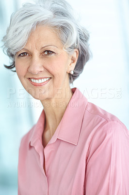Buy stock photo Portrait of one happy senior caucasian woman with grey hair enjoying free time at home. Face of carefree, wise and cheerful retired lady smiling, feeling optimistic about life and ageing gracefully 
