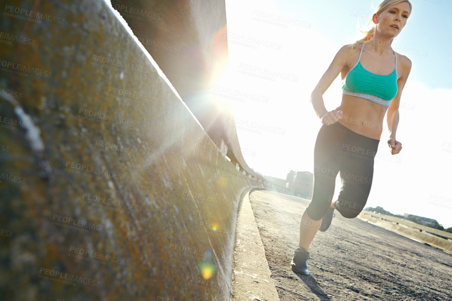 Buy stock photo Sports, speed and woman on bridge for running with race, marathon or endurance training. Fitness, health and female athlete runner with cardio workout by highway for outdoor wellness exercise.