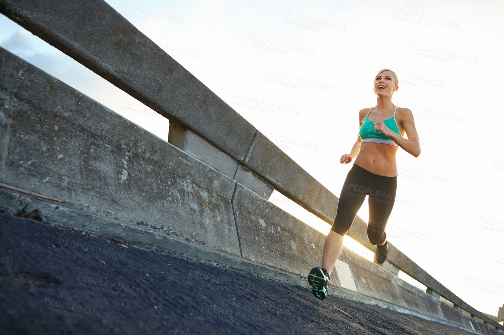 Buy stock photo Sports, challenge and woman on bridge for running with race, marathon or endurance training. Fitness, health and female athlete runner with cardio workout for speed by highway for outdoor exercise.