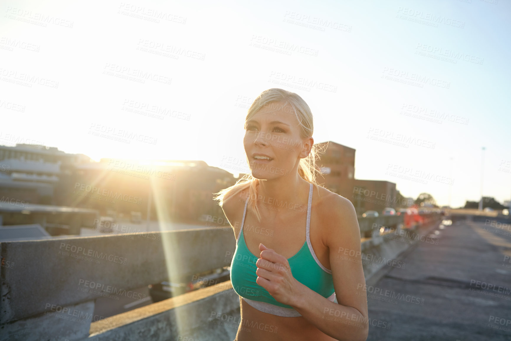 Buy stock photo Fitness, running and woman in city, training and sunshine with journey, challenge and balance. Healthy person, outdoor or runner with endurance, cardio or practice with lens flare, exercise or energy