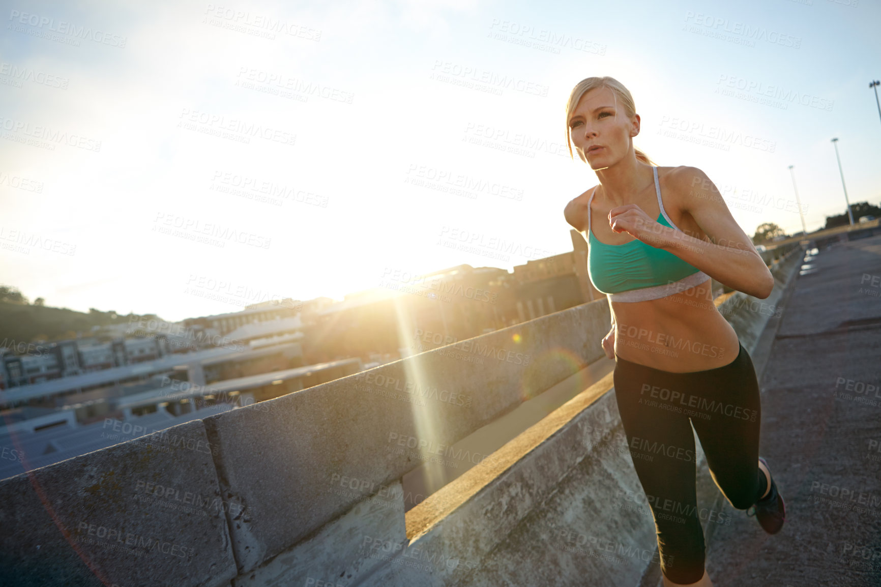 Buy stock photo Sunshine, running and woman in city, exercise and practice with journey, challenge or wellness. Healthy person, outdoor or runner with endurance, training or energy with lens flare, balance or cardio