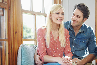 Buy stock photo Shot of a happy couple enjoying a leisurely day at home together