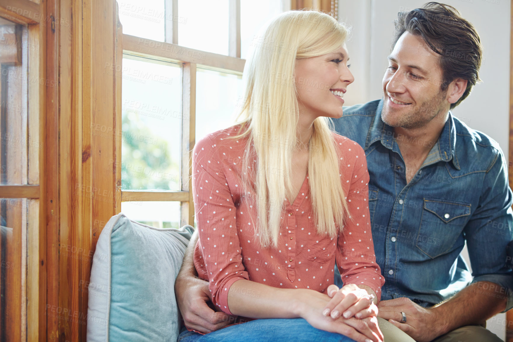 Buy stock photo Shot of a happy couple enjoying a leisurely day at home together