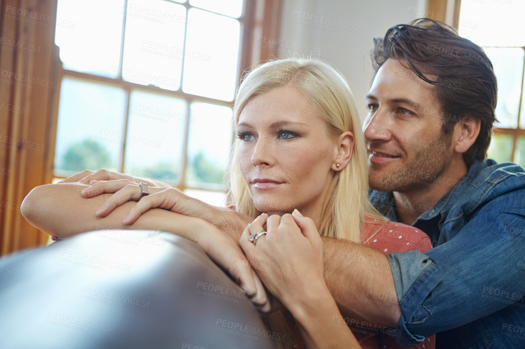 Buy stock photo Happy, couple and hug together on sofa for time, support and bonding in dream home for marriage and future. Smile, man and woman with love embrace on couch for relationship, commitment and growth 