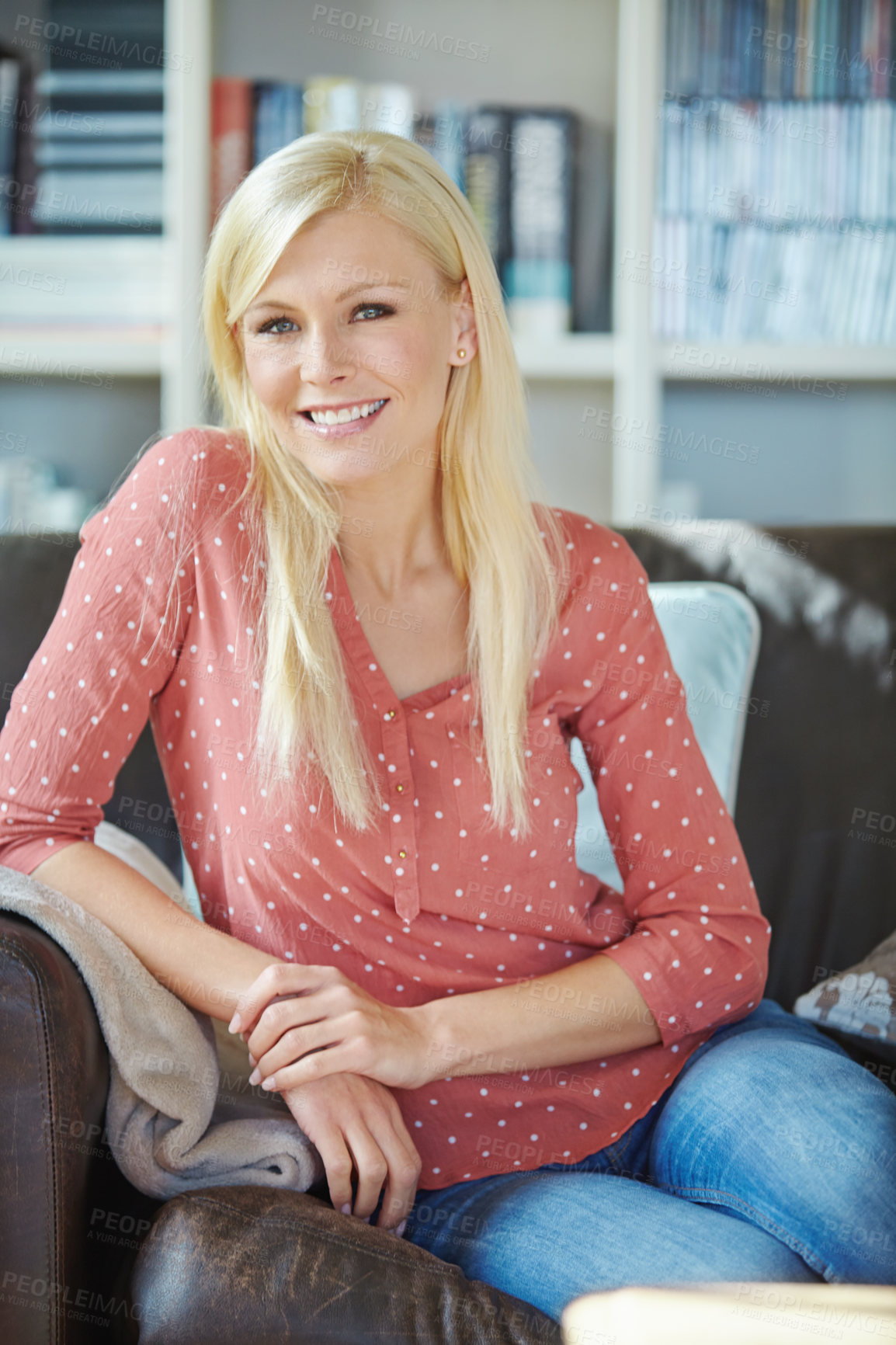 Buy stock photo Portrait, woman and relax on couch at house in living room for care, happiness or relaxation with books for reading . Smile, female person and peace at home library for calm weekend

