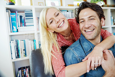 Buy stock photo Smile, embrace and happy couple on sofa with portrait, love and bonding in home lounge. Hug, man and woman on couch relaxing, romantic or enjoying conversation, relationship or weekend in living room