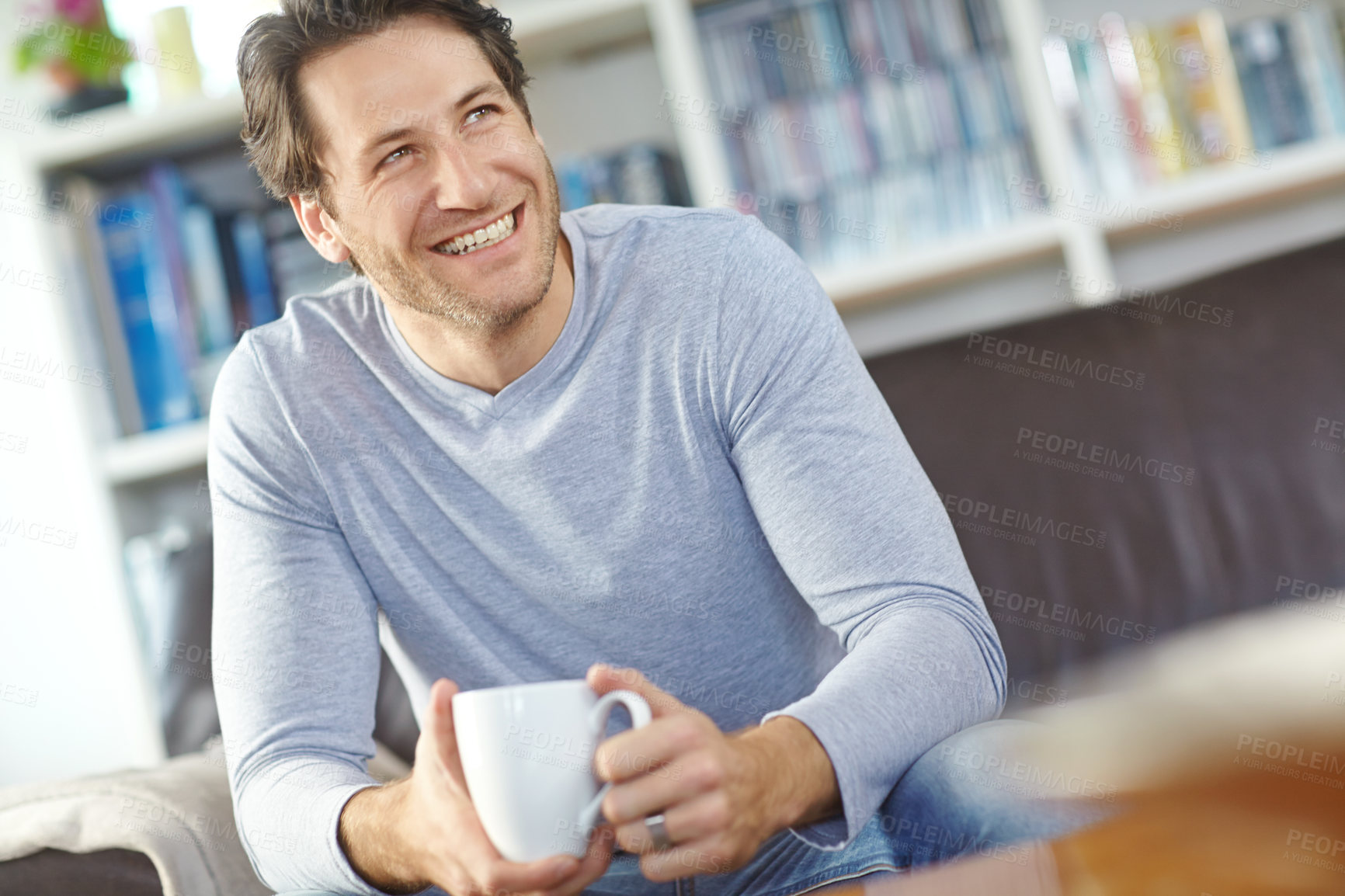 Buy stock photo Thinking, home and man on couch, coffee and relax with happiness, wellness and ideas in living room. Face, apartment and person with morning tea, daydreaming and guy with cappuccino and weekend break