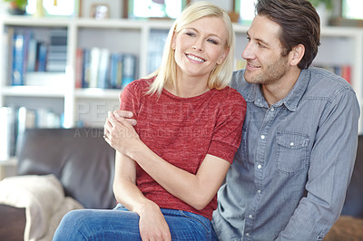 Buy stock photo Love, hug and couple on sofa in living room together for happiness, bonding and care. Smile, embrace and married man with woman with trust for support, comfortable and relax on weekend break in home