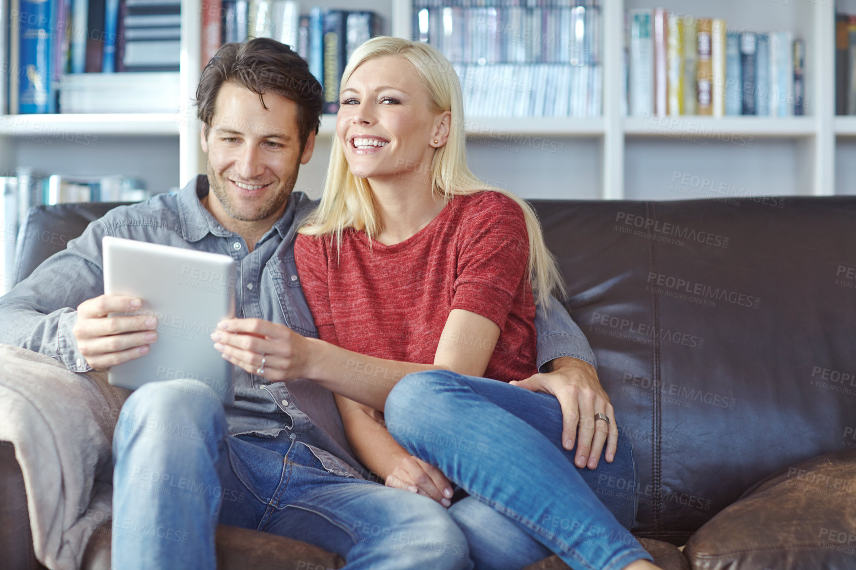 Buy stock photo Couple, love and tablet on sofa in living room for social media, bonding or streaming videos together. Online, app and married man with woman for entertainment, comfortable or watching movie in home