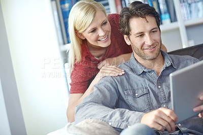 Buy stock photo Happy, couple and home couch with tablet or relaxing online, people smile and internet browse together on social media. Web, scrolling and relationship bonding, networking and communication apartment