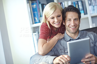 Buy stock photo Smile, couple and home couch with tablet or relaxing online, people happy and internet browse together on social media. Web, scrolling and relationship bonding, networking and communication apartment