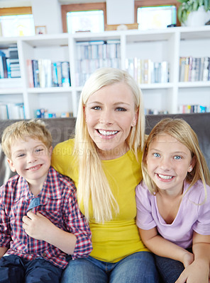 Buy stock photo Happy mother, portrait and relax with children for bonding, love or care on holdiay or weekend on sofa at home. Mom, siblings and young kids with smile for fun break together in living room at house