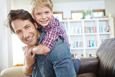 Buy stock photo Portrait of a happy father and son enjoying time together at home