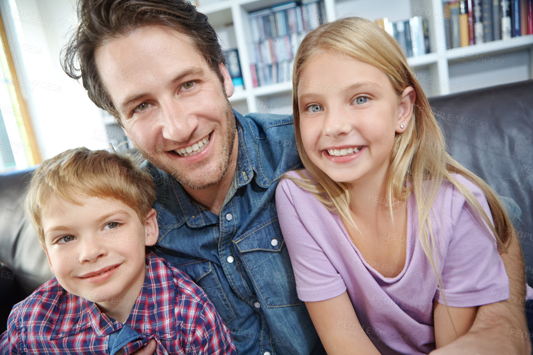 Buy stock photo Portrait, dad and children on couch with embrace, bonding and love in living room for playful family in home. Relax, father and kids on sofa for happy weekend together with fun, smile and hugging.