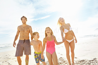 Buy stock photo Holding hands, beach and happy family on holiday together for summer vacation, travel and bonding. Mother, father and kids at ocean for adventure, support and funny parents laughing with children