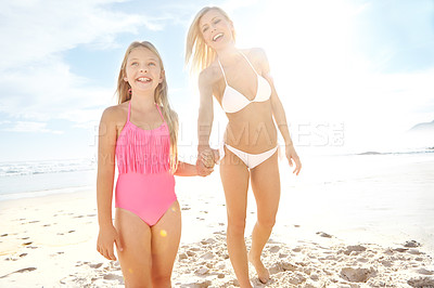 Buy stock photo Happy, woman and kid at beach with smile for summer vacation, bonding and adventure in sunshine. Nature, sea and mom with girl on sand by ocean for childhood, holiday and weekend trip in California