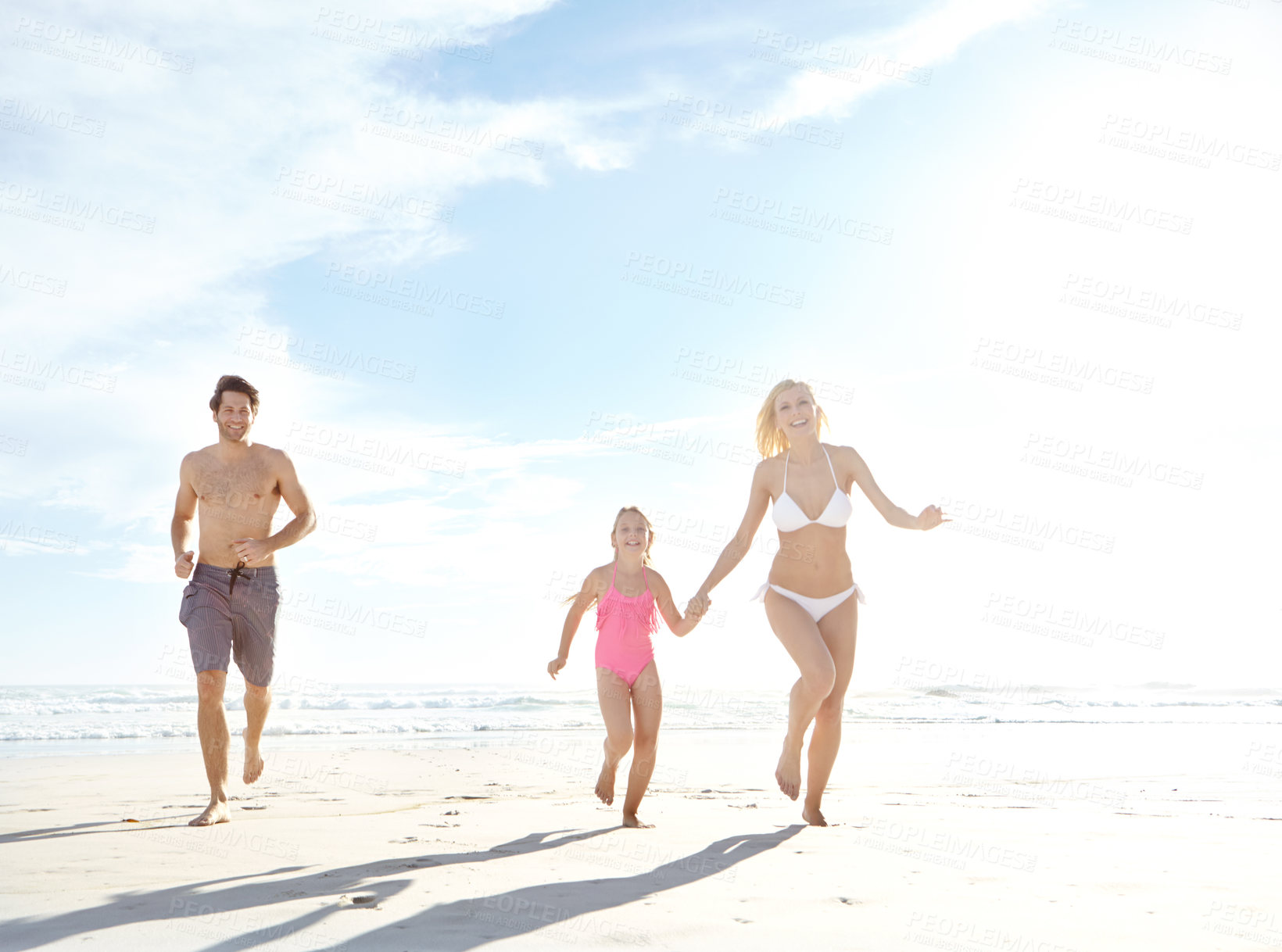 Buy stock photo Family, happy and running in beach for holiday in summer with bonding, support and care in Miami. Parents, girl and smile or excited with fun at seaside on vacation, trip and travel on portrait