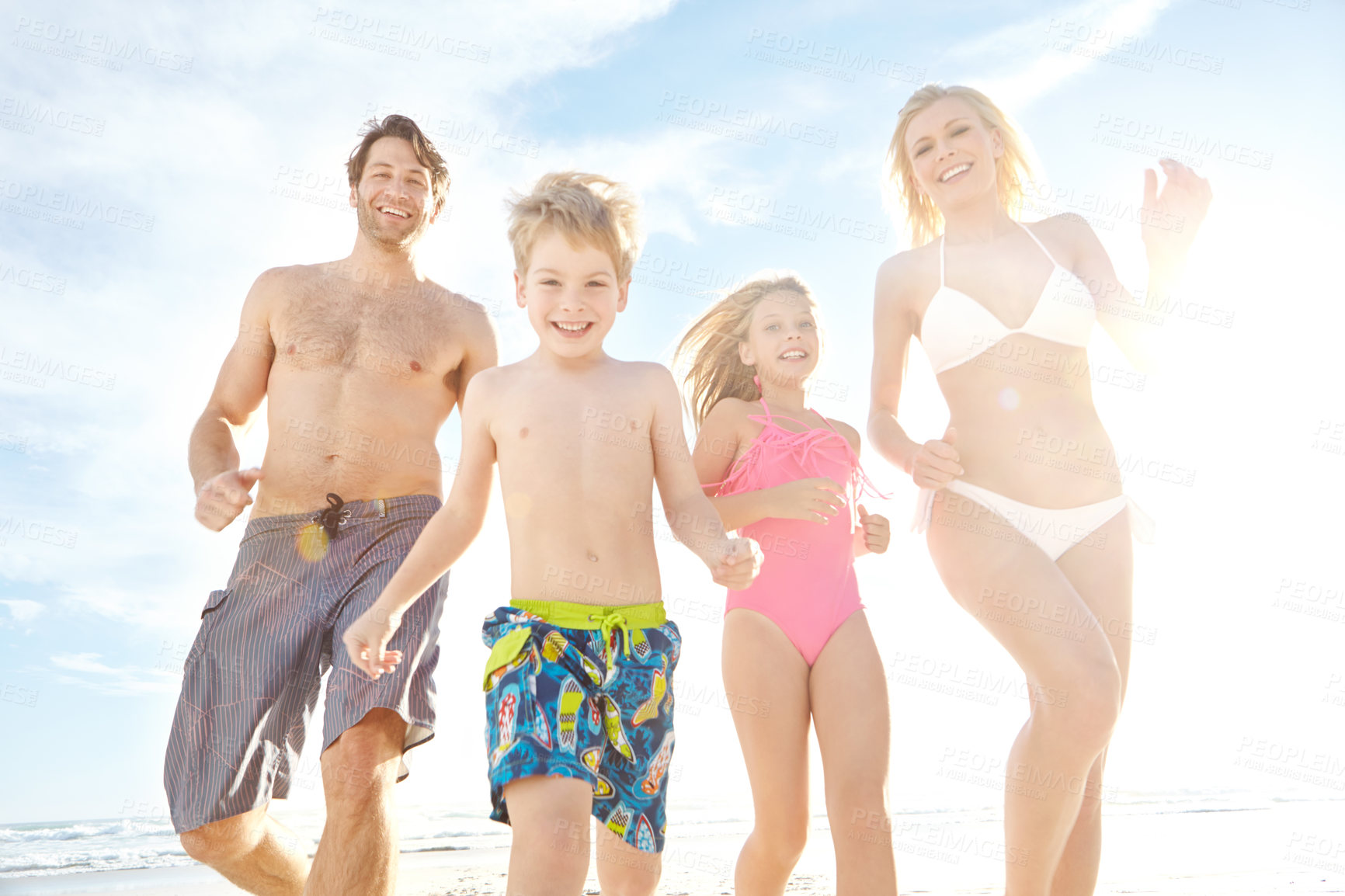 Buy stock photo Portrait, beach and sunshine with vacation, family and happiness with summer, travel and bonding together. Energy, mother or father with children, kids and seaside for holiday, adventure and journey