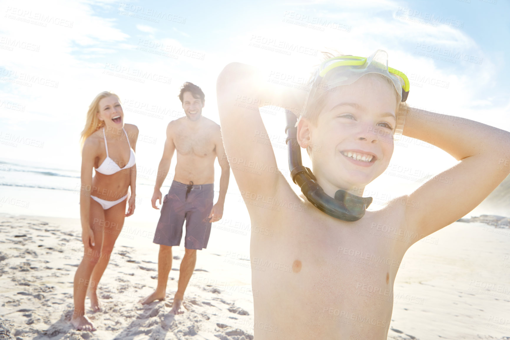 Buy stock photo Excited, family and child relax on beach with snorkeling goggles for adventure and travel on vacation. Holiday, journey and kid with parents in Florida, summer or thinking of swimming with safety