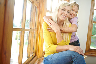 Buy stock photo Happy mother, portrait and child with hug for love, support or care in bonding, holiday or weekend together at home. Mom, daughter or young kid with smile in relax by window for embrace or comfort