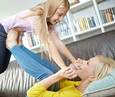 Buy stock photo Home, mom and lifting girl in air with happiness and flying with support and trust in family. Kid, games and mother relax on couch with child to raise with freedom in house on holiday or vacation