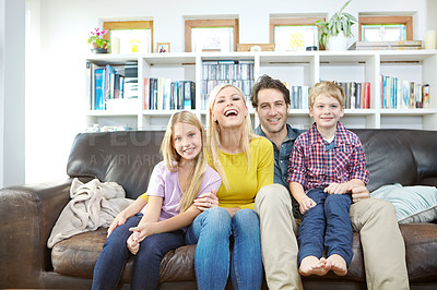 Buy stock photo Parents, children and relax on sofa laughing with love, care and happy for holiday, weekend or vacation at home. Portrait of excited mother, father and kids together on couch in living room or lounge