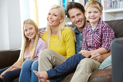 Buy stock photo Parents, kids and happy on couch in portrait with love, care and relax for holiday, weekend or vacation at home. Family or mom and dad with kids together for bonding on sofa in living room or lounge
