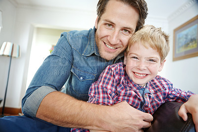 Buy stock photo Portrait, father and child on sofa with smile, bonding and love in living room for playful family in home. Relax, dad and son on couch laughing on happy weekend together with fun, playing and embrace