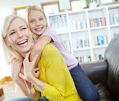 Buy stock photo Portait of a loving mother and daughter spending time together at home
