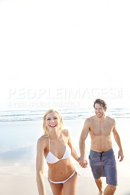 Buy stock photo Holding hands, walking and couple on beach for travel, vacation or holiday with romance together. Happy, mockup and young man and woman by ocean for bonding on tropical weekend trip in Australia.