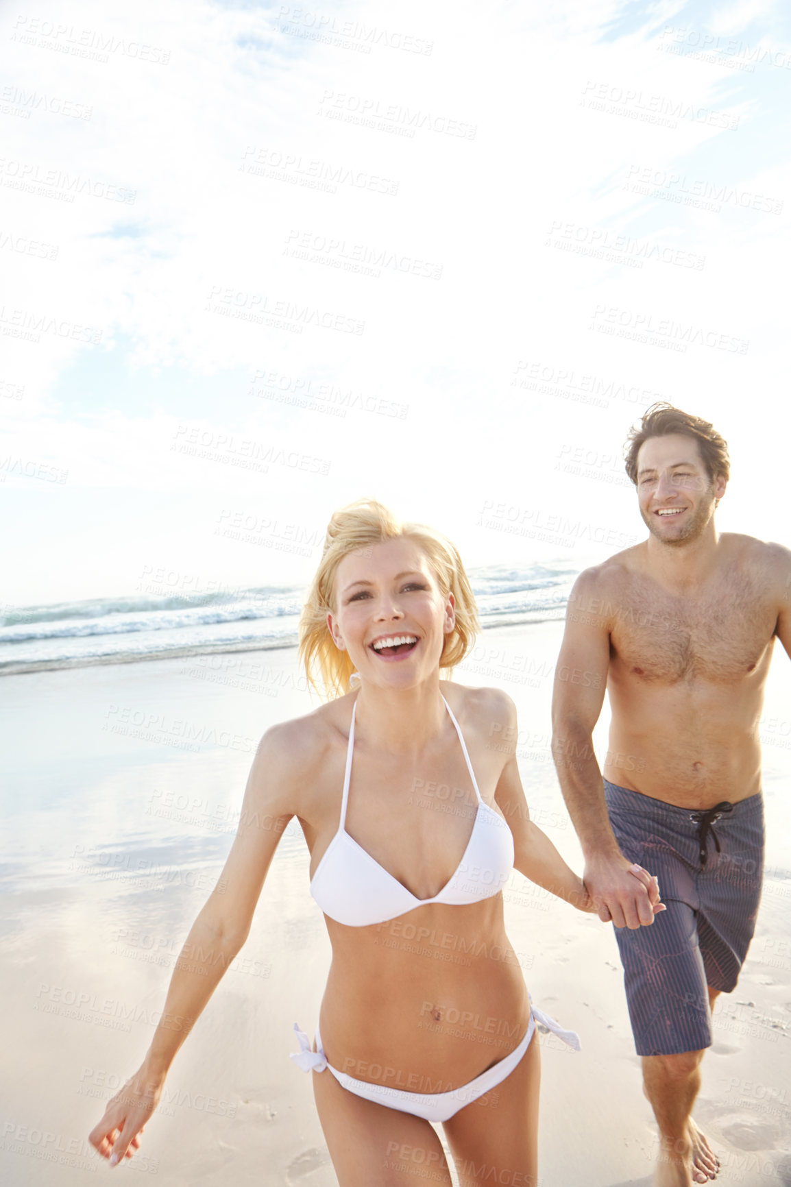 Buy stock photo Holding hands, walking and portrait of couple on beach for travel, vacation or holiday with romance together. Happy, summer and young man and woman by ocean for bonding on weekend trip in Australia.