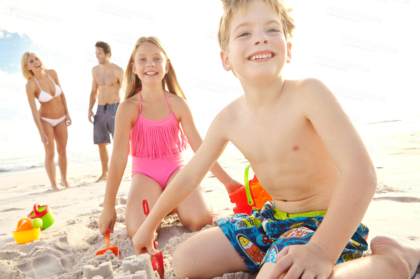 Buy stock photo Children, family and happy at beach for vacation, adventure and travel for holiday in summer. Mother, father and portrait of girl in nature with smile, boy and sand in Bali with parents by ocean