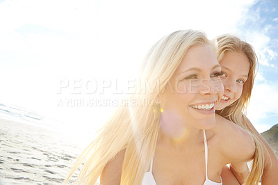 Buy stock photo Piggyback, woman and kid at beach with smile for sunshine holiday, summer and adventure together. Ocean, nature and mother with girl by sea for vacation, bonding and weekend fun in California