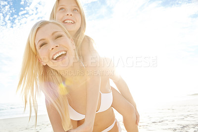 Buy stock photo Happy, mother and child with piggyback at beach for summer travel, vacation and bonding together. Smile, nature and woman with girl kid by ocean for holiday, adventure and weekend fun in Cancun